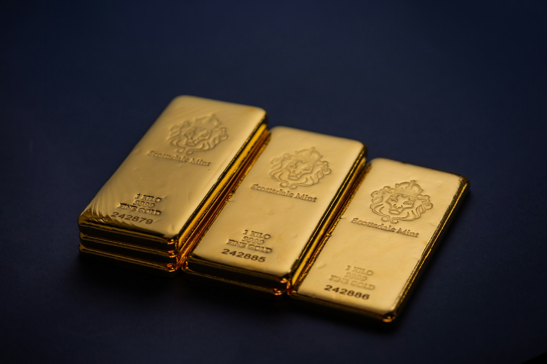 Stacked gold bars representing physical gold trading
